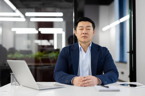 Office professional practicing mindful awareness at desk